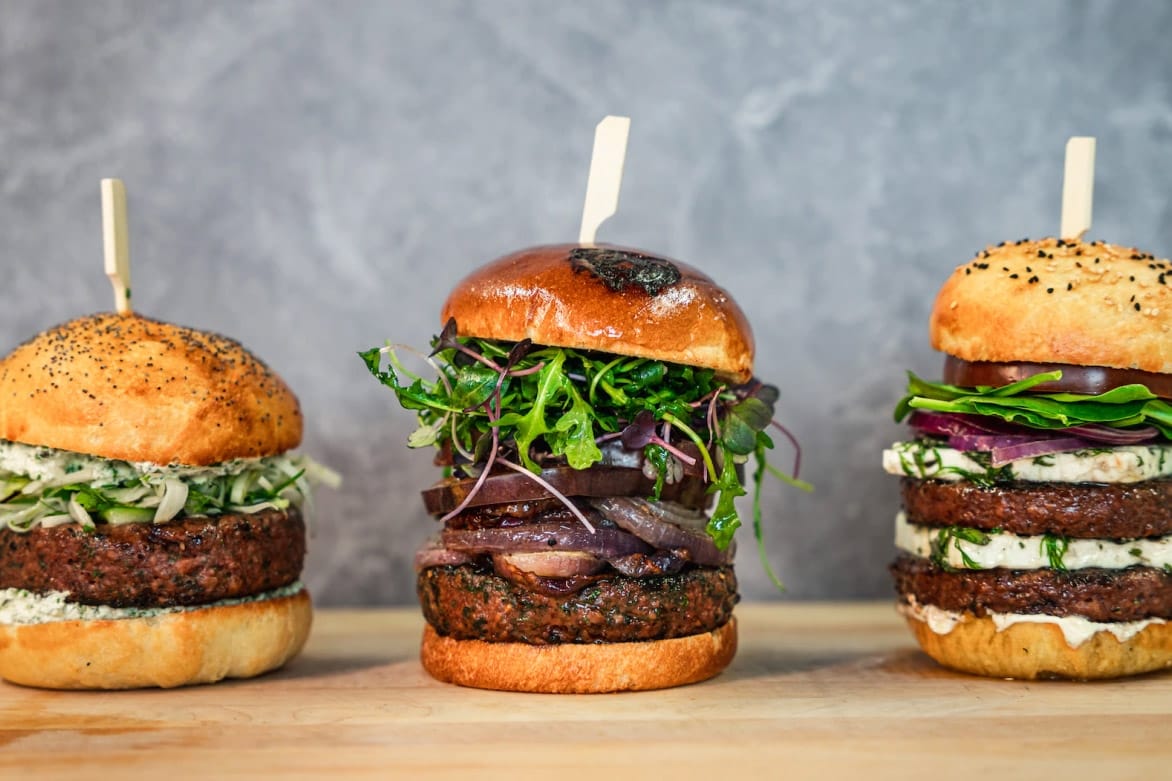 Three burgers made with Black Sheep plant-based lamb