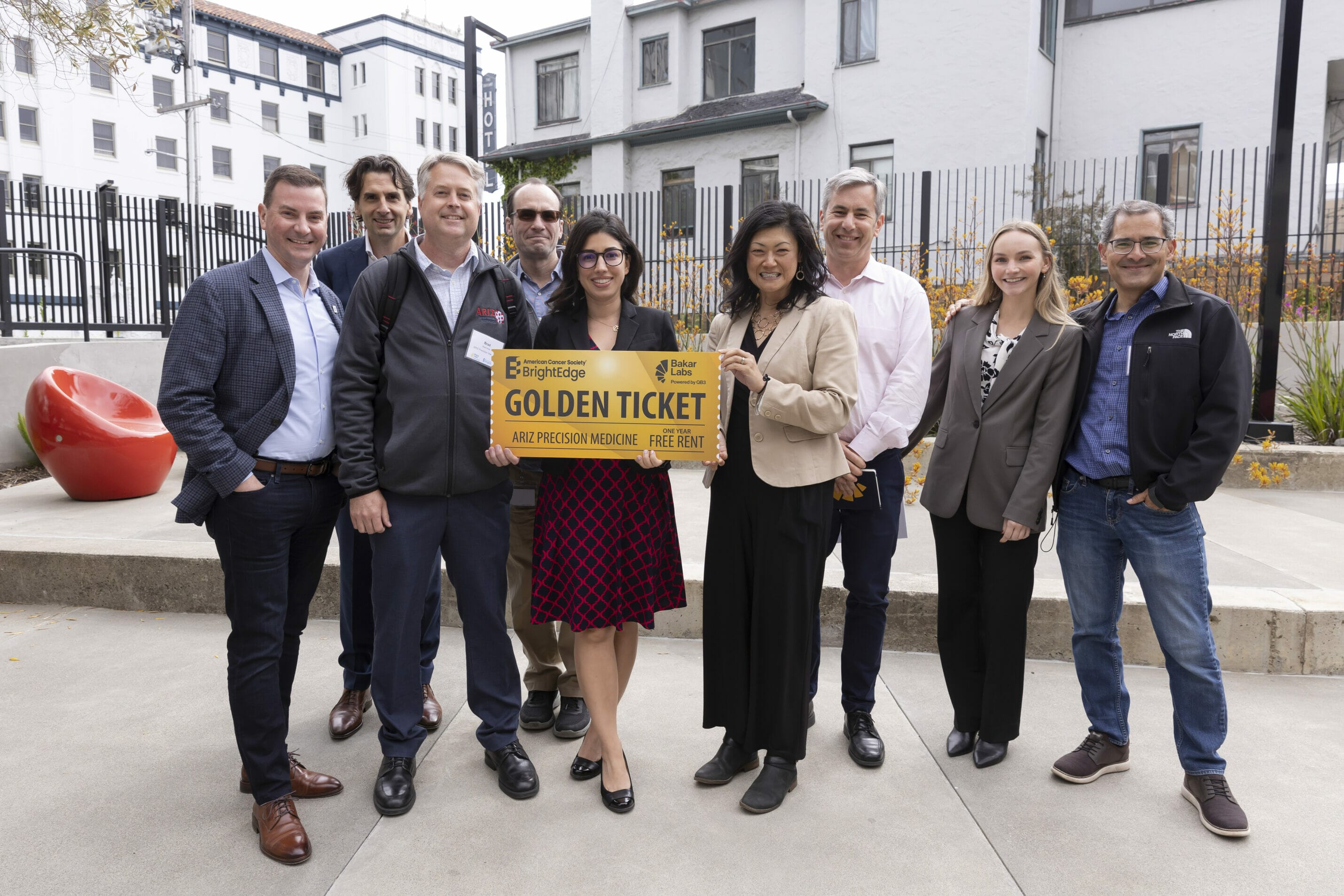BrightEdge's Farnaz Bakshi (center) presents Golden Ticket to Brad Niles, CEO of ARIZ (third from left) along with the BrightEdge and Bakar Labs teams