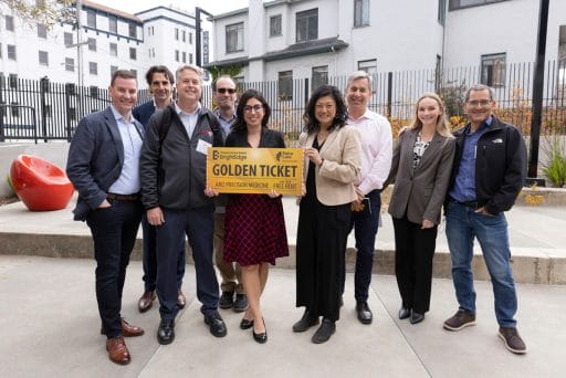 Farnaz Bakshi (center) presents the Golden Ticket to Brad Niles, CEO of ARIZ (third from left) along with the ACS BrightEdge and Bakar Labs teams.