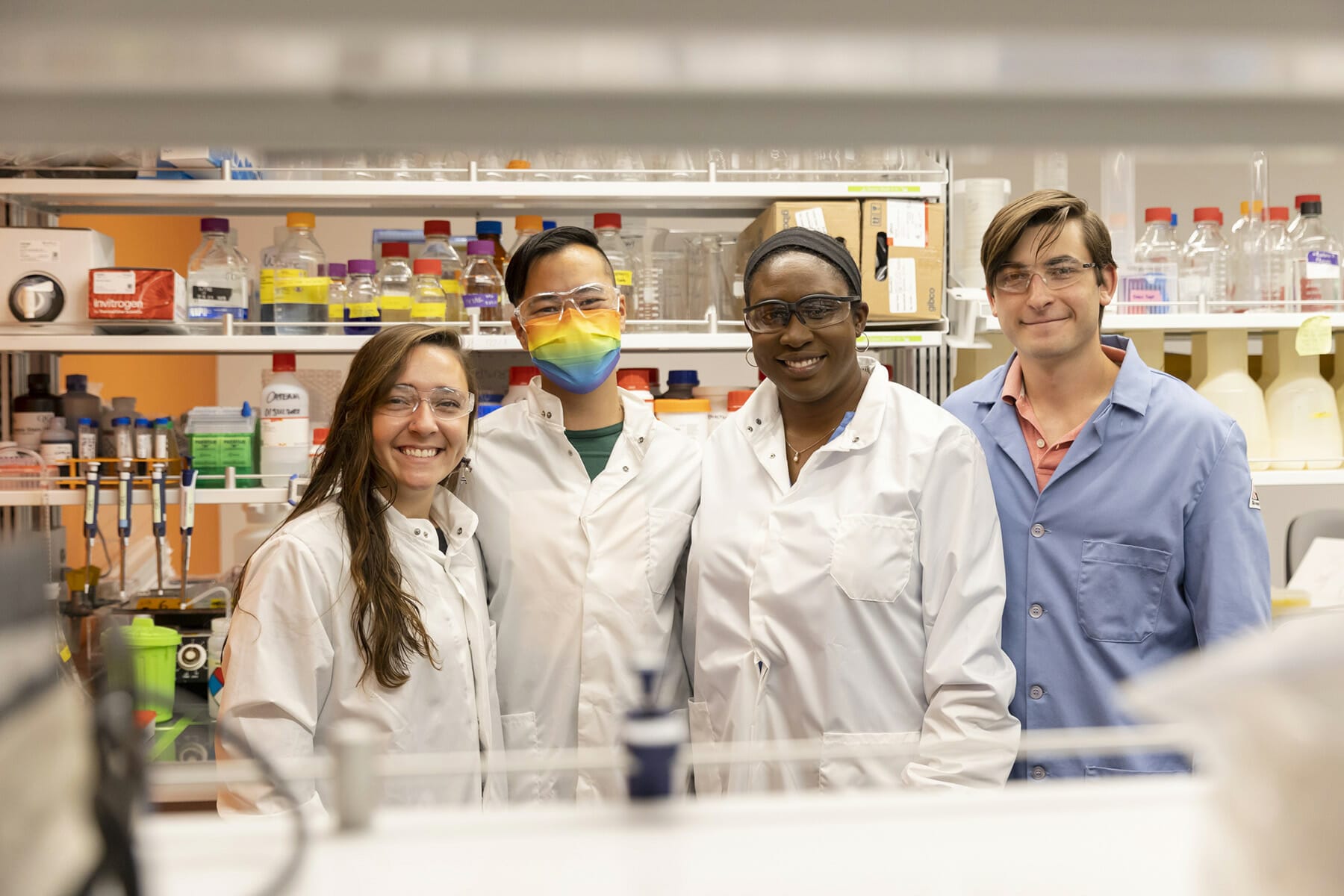 Four scientists from Catena Biosciences wearing lab coats